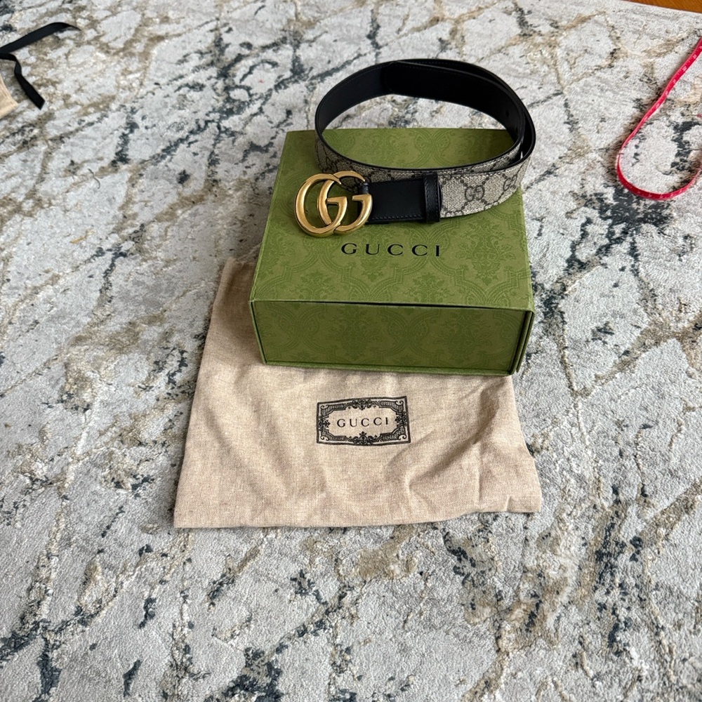 Gucci authentic Designer Gold and Black Belt